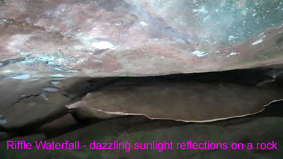 video clip of the sun and water reflections on a rock at the Riffle Waterfall in Millwood WV